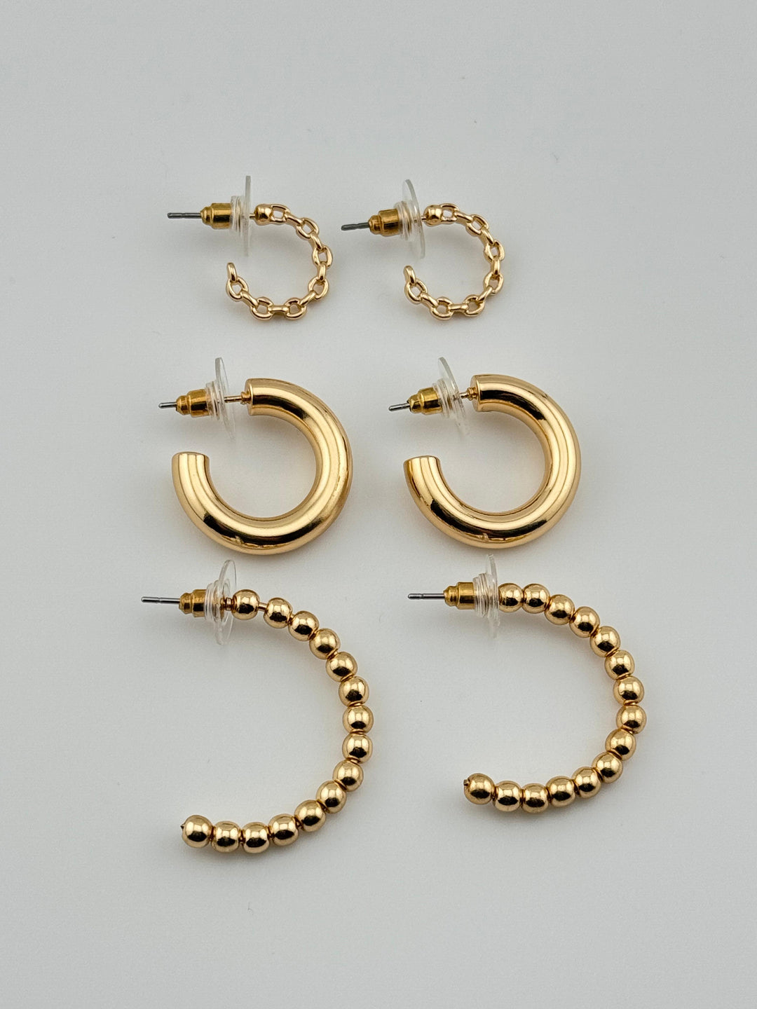 3-Piece Gold-Tone Hoop Earrings Set with Chain Detail, 3 pairs of hoop earrings with different styles (chain, thick, and beaded)